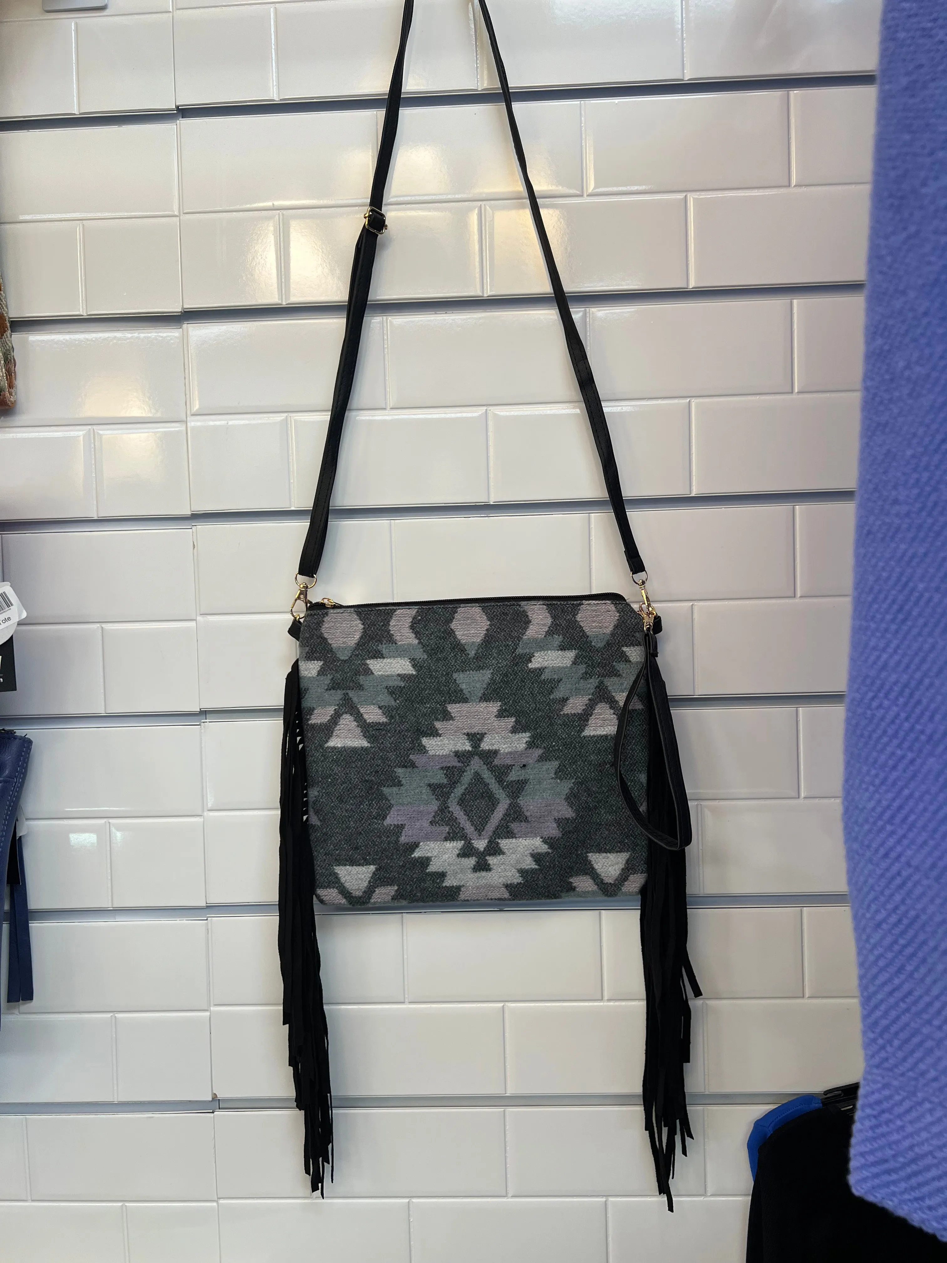 Crossbody handbags with wristlet straps